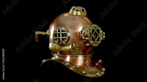 Antique vintage USA marine deep sea diver boston brass and copper helmet. A nautical diving underwater breathing helmet.