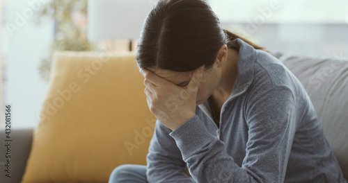Fotografia Sad depressed woman self-isolating at home