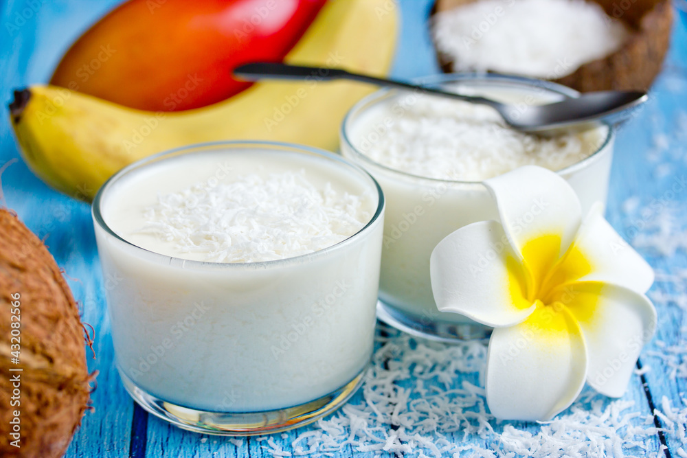 Coconut panna cotta, delicious creamy dessert in a glass in a hawaiian style Coconut panna cotta, delicious creamy dessert in a glass in a hawaiian style