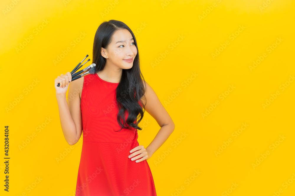 Portrait beautiful young asian woman with cosmetic brush Portrait beautiful young asian woman with cosmetic brush