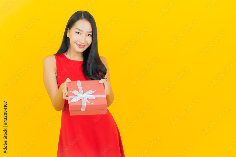 Portrait beautiful young asian woman smile with red gift box Portrait beautiful young asian woman smile with red gift box