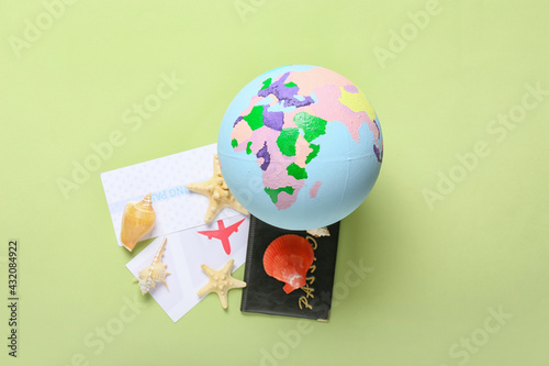 Globe with passport and tic...