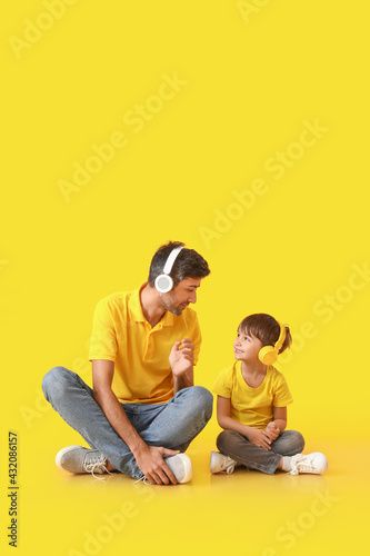 Father and little son liste...