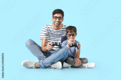 Father and little son playi...