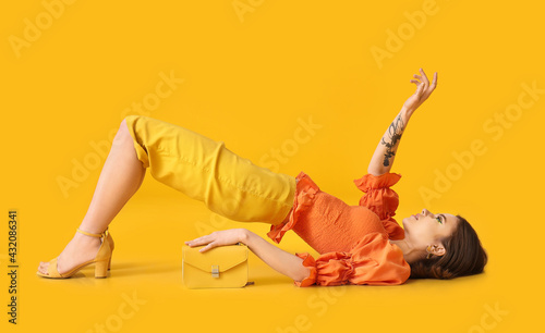 Lying young woman with bag ...