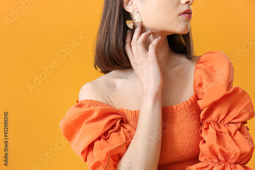 Stylish young woman on yell...