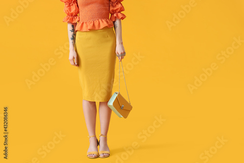 Stylish young woman with ba...
