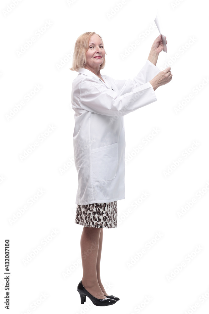 in full growth.female doctor looking at an x-ray. in full growth.female doctor looking at an x-ray.