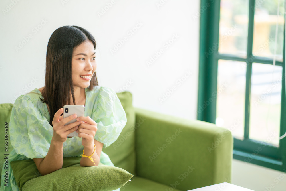 Beautiful asian women sitting in cafe use smartphone social media Beautiful asian women sitting in cafe use smartphone social media