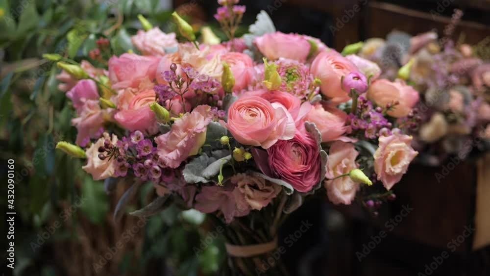 Pink tones beautiful bouquet of mixed flowers at a florist shop. Handsome fresh bouquet. Flowers delivery.