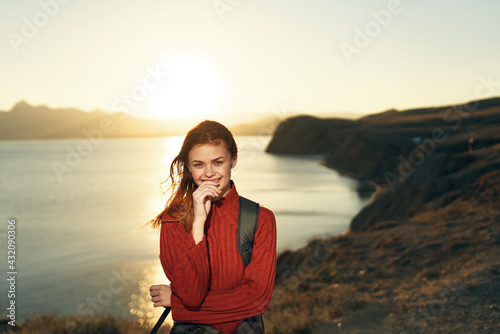 smiling woman hiker with backpack rocky mountains travel