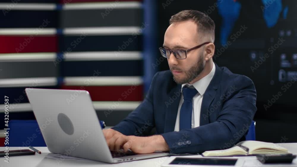 Focused successful man in suit working use laptop at modern hi tech office chatting surfing internet Focused successful man in suit working use laptop at modern hi tech office chatting surfing internet