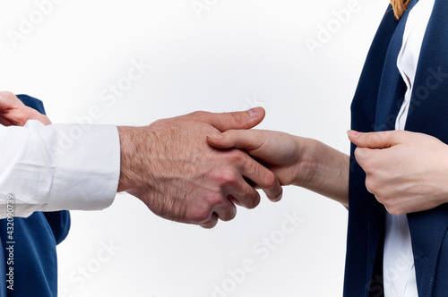 work colleagues shake hands communication contract light background