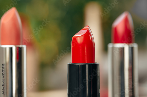 New red lipstick on vanity table close up