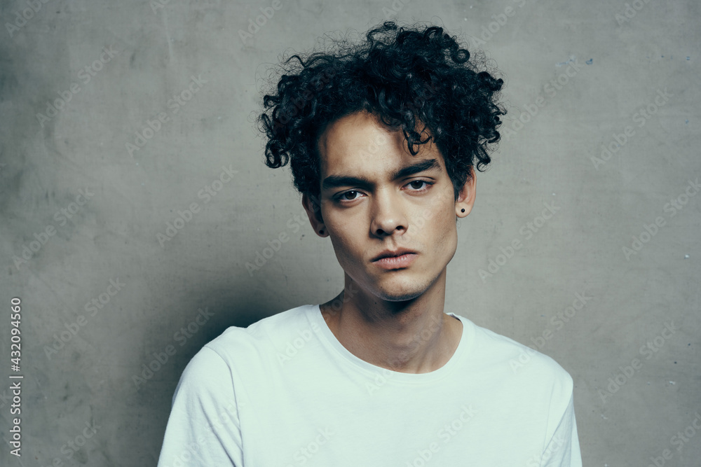 cute guy curly hair emotions studio cropped view cute guy curly hair emotions studio cropped view