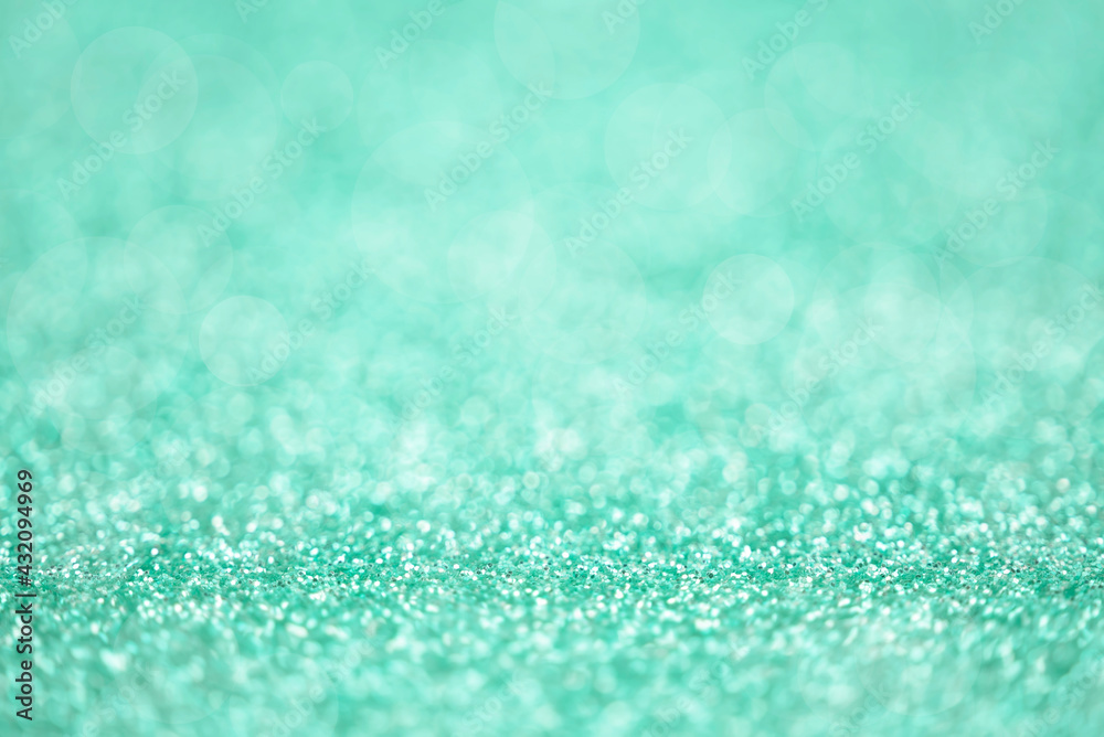 Obraz premium Texture of light green silver glitter dust surface, luxury background with bokeh