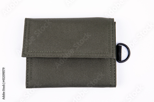Green wallet on a white background. Fabric product