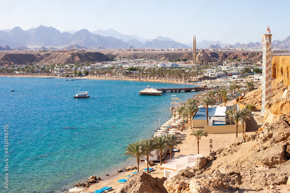 Sharm El Maya bay, Red sea and Sinai mountains on a background. Boat trips and sightseeing in Egypt, Sharm el-Sheikh. Travel and tourism concept.