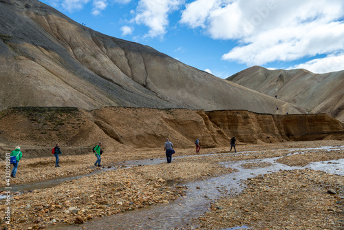  Hikers in volcanic mountains of Landmannalaugar in Fjallabak Nature Reserve. Iceland