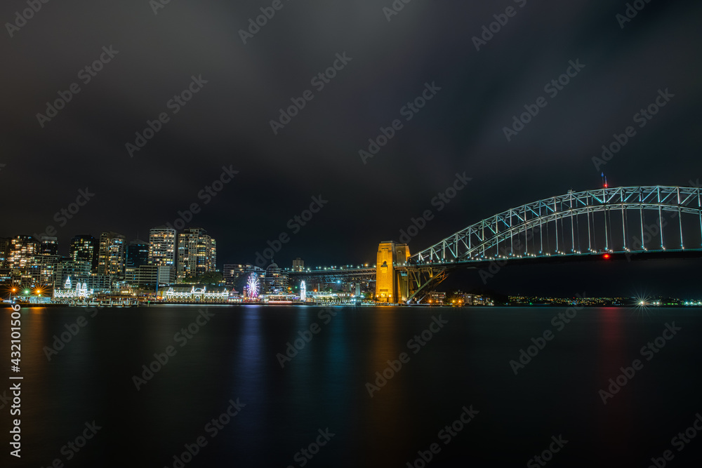 Sydney Harbour bridge and Lunar park lights in the night sky. Sydney Harbour bridge and Lunar park lights in the night sky.