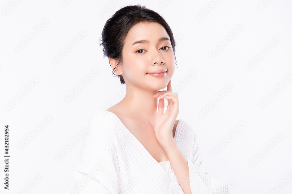 Beautiful young Asian woman wearing bathrobe on white background, Face care, Facial treatment, Cosmetology, beauty and spa Concept. Beautiful young Asian woman wearing bathrobe on white background, Face care, Facial treatment, Cosmetology, beauty and spa Concept.