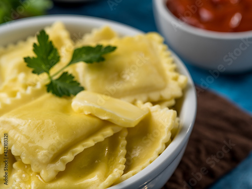 Ready homemade ravioli or dumplings with sauces Delicious homemade food