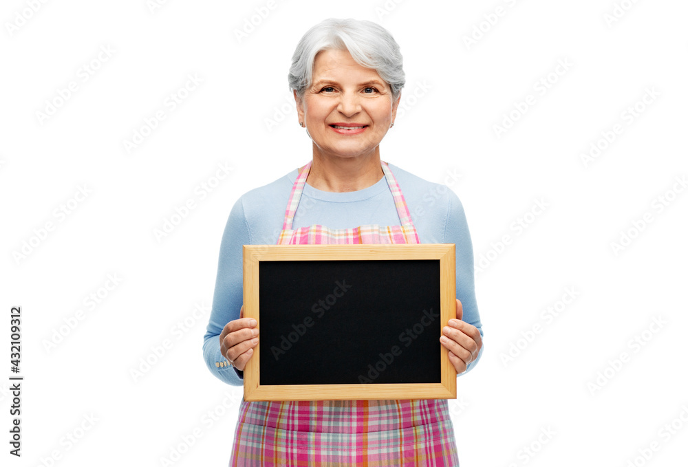 cooking, culinary and old people concept - portrait of smiling senior woman in kitchen apron holding chalkboard over white background cooking, culinary and old people concept - portrait of smiling senior woman in kitchen apron holding chalkboard over white background