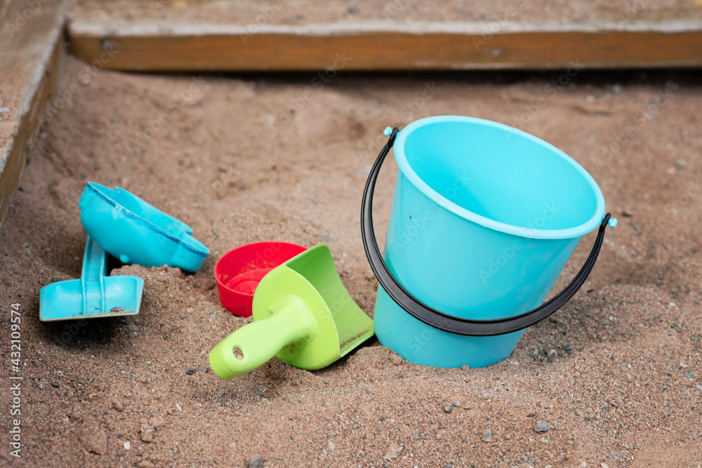Sandbox toys (bucket and spades) for outdoor play in the sand Sandbox toys (bucket and spades) for outdoor play in the sand