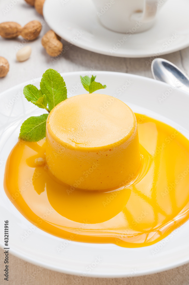 very tender sea buckthorn mousse on a white plate decorated with mint very tender sea buckthorn mousse on a white plate decorated with mint
