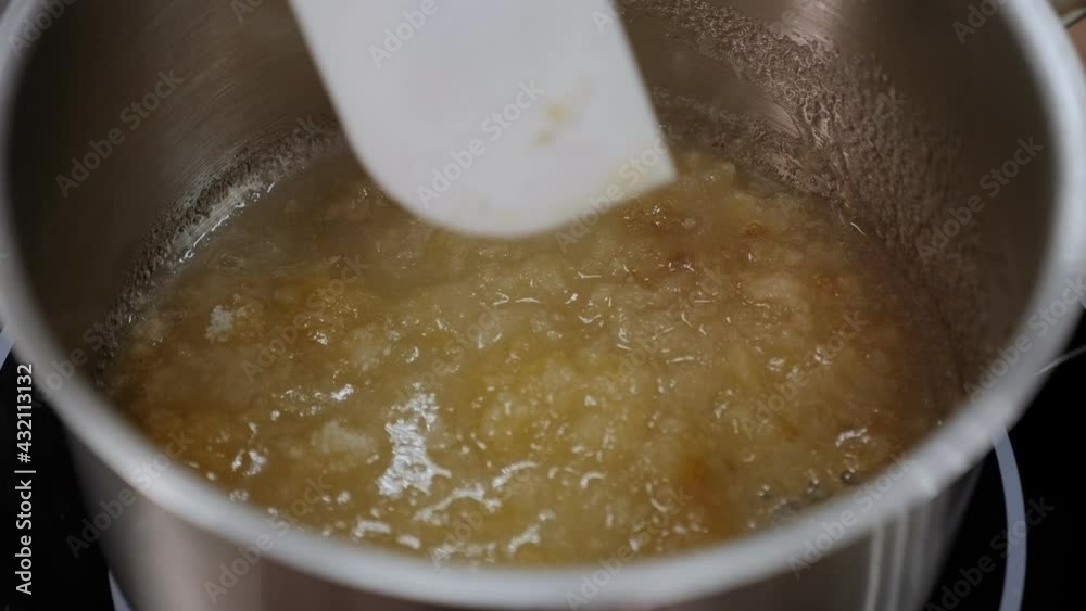 Close-up of the process of preparing caramel, caramel boils in a pan. Close-up of the process of preparing caramel, caramel boils in a pan.