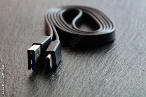 Black USB Type-C cord on black background
