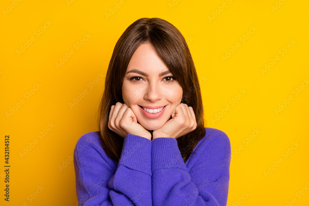 Portrait of gorgeous satisfied lady arms on cheeks toothy smile wear pullover isolated on yellow color background Portrait of gorgeous satisfied lady arms on cheeks toothy smile wear pullover isolated on yellow color background