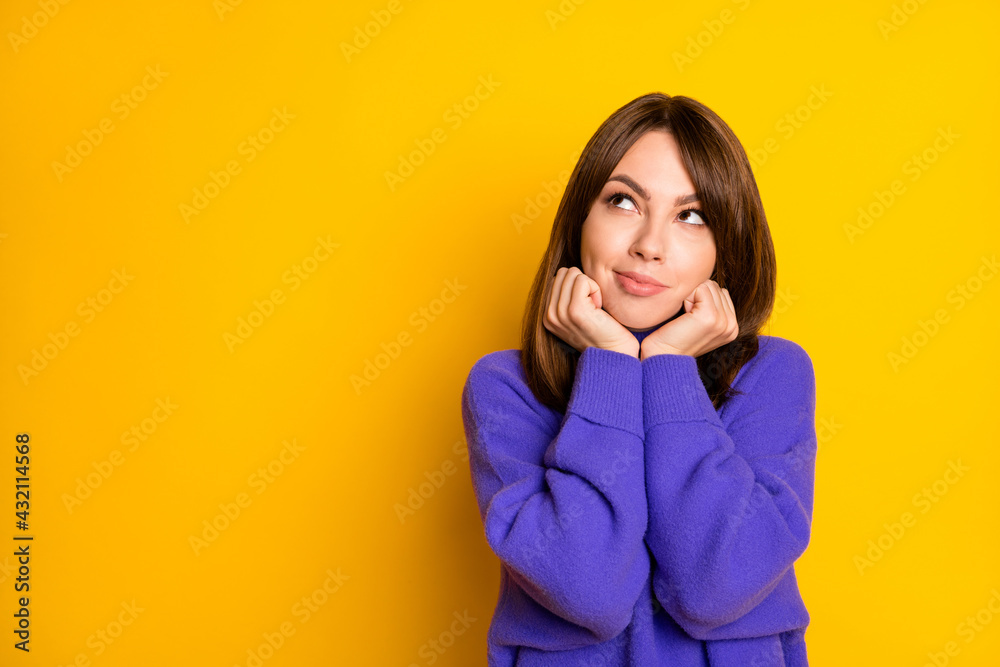 Photo of funny thoughtful young lady dressed violet sweater arms cheekbones looking empty space isolated yellow color background Photo of funny thoughtful young lady dressed violet sweater arms cheekbones looking empty space isolated yellow color background