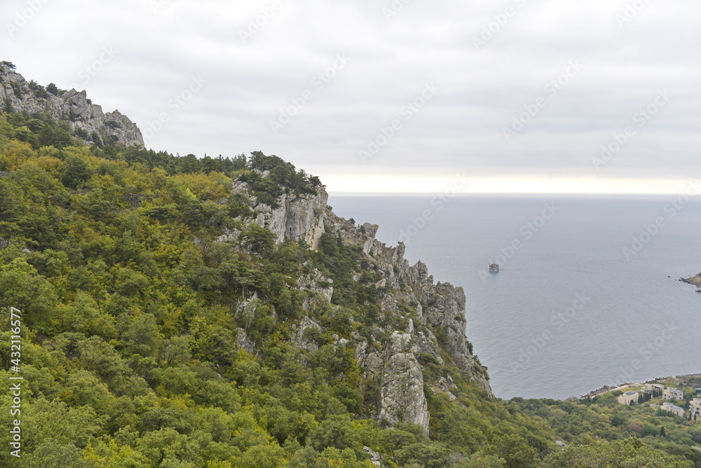 Sevastopol, Crimea - 10.15.2015 : Rocky mountains with different vegetation on the background of the Black Sea