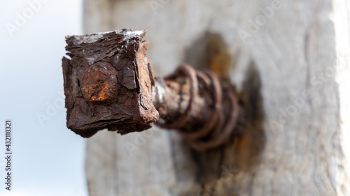 A rusted bolt remaining in the posts atthe myponga jetty ruins on the fleurieu peninsula south australia on may 3rd 2021