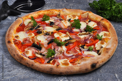 pizza with bacon, sweet peppers, mushrooms, onions and mozzarella cheese