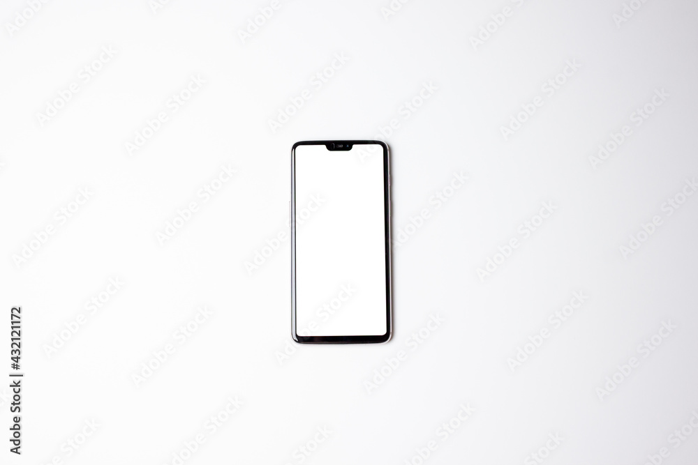 A phone with a white screen. Phone on a white background. Free space on the phone screen. A phone with a white screen. Phone on a white background. Free space on the phone screen.