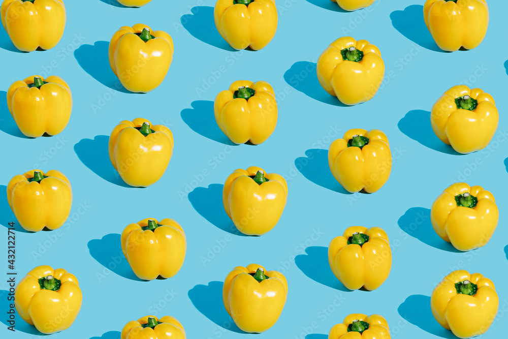 Pattern with fresh yellow bell peppers isolated on pastel blue background. Creative organic vegetable concept. Banner for healthy food or diet. Pop art aesthetic texture. Pattern with fresh yellow bell peppers isolated on pastel blue background. Creative organic vegetable concept. Banner for healthy food or diet. Pop art aesthetic texture.