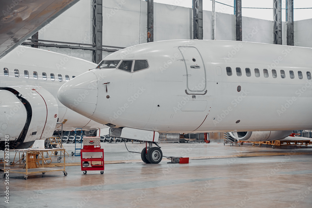 Professional plane expluatation service in big hangar Professional plane expluatation service in big hangar