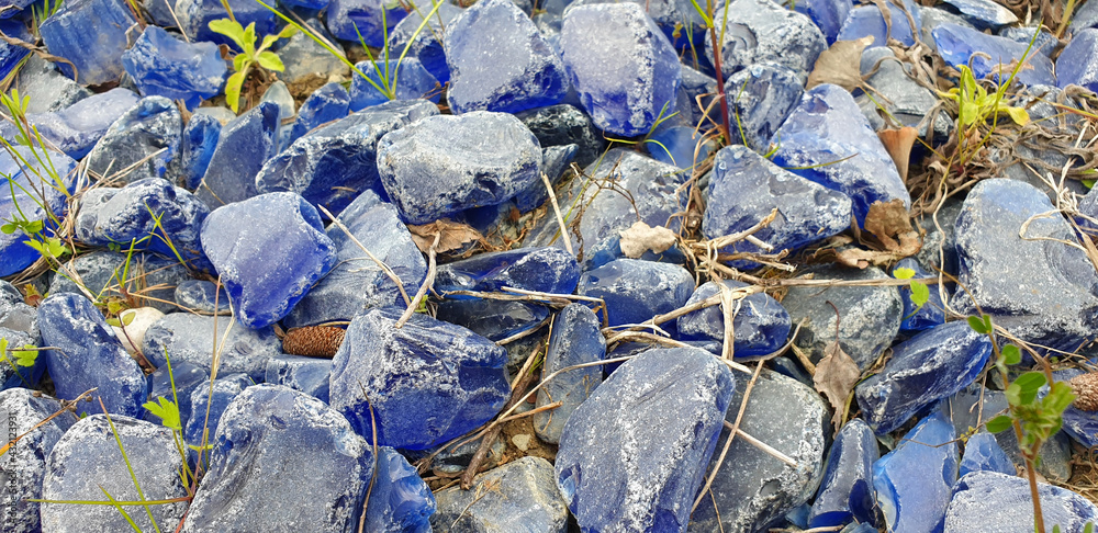 Panorama of blue glass stones for decoration.