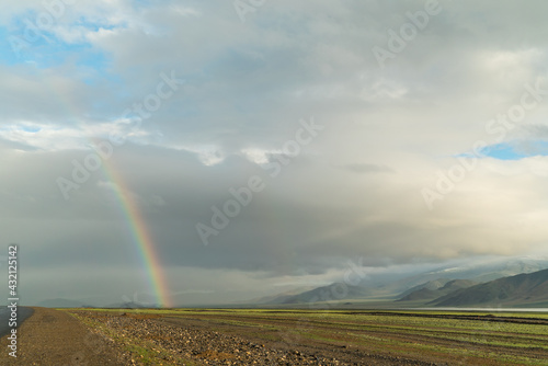 the beginning of a rainbow on a beautiful mountain sunny landscape © Jonny
