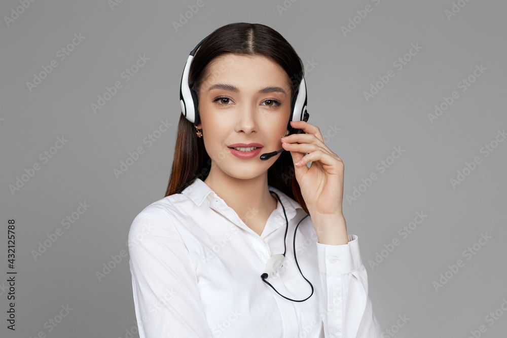 caucasian woman with headset on gray background caucasian woman with headset on gray background