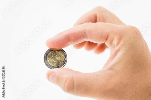 hand with euro coin