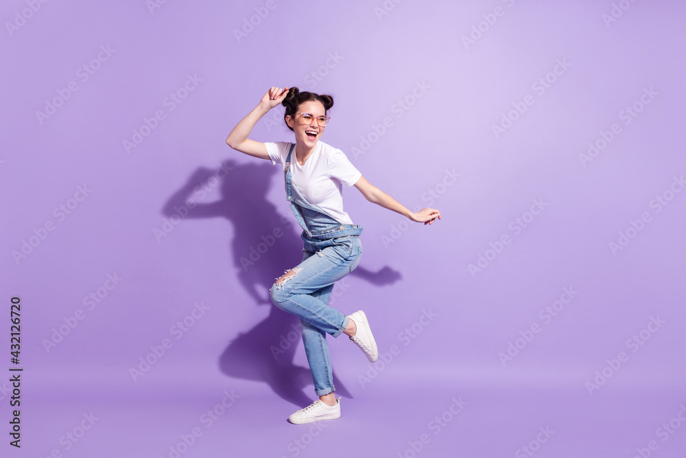 Full body profile photo of sweet brown hair lady dance wear spectacles t-shirt overall isolated on violet background