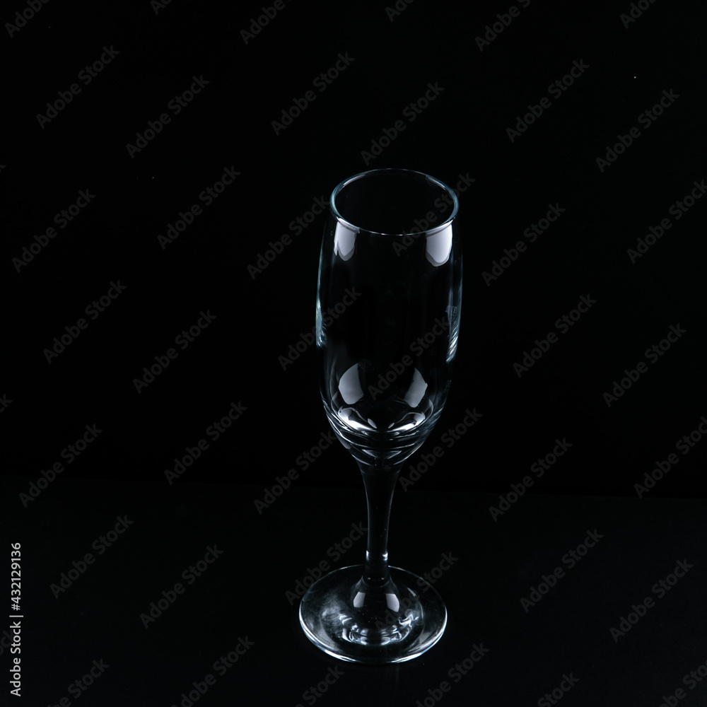empty champagne flute on the black surface empty champagne flute on the black surface