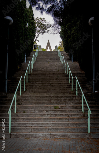 Fototapeta Naklejka Na Ścianę i Meble -  long tall stairs with tree path