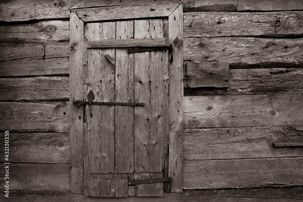 Mysterious old wooden door. Sepia photography. Mysterious old wooden door. Sepia photography.