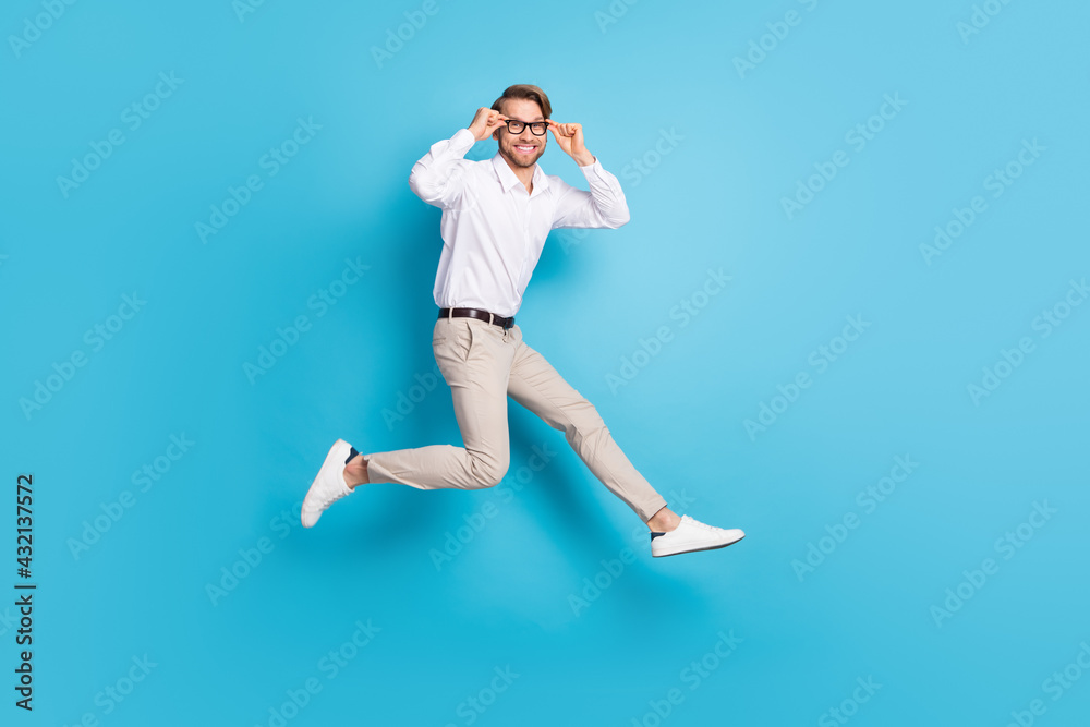 Full length body size view of attractive funny cheerful man jumping running  touching specs isolated over bright blue color background Stock Photo |  Adobe Stock