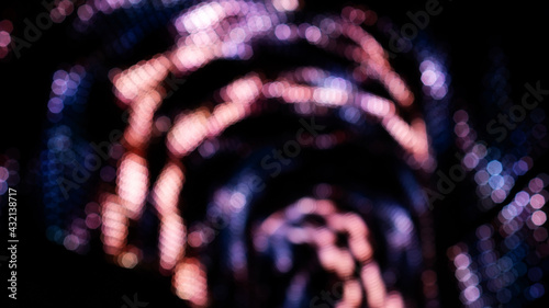 Bilde på lerret Pink and violet bokeh on a dark background.