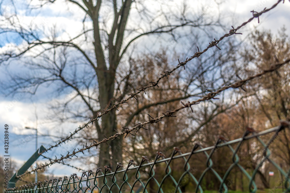barbed wire fence and metal bar fencing barbed wire fence and metal bar fencing